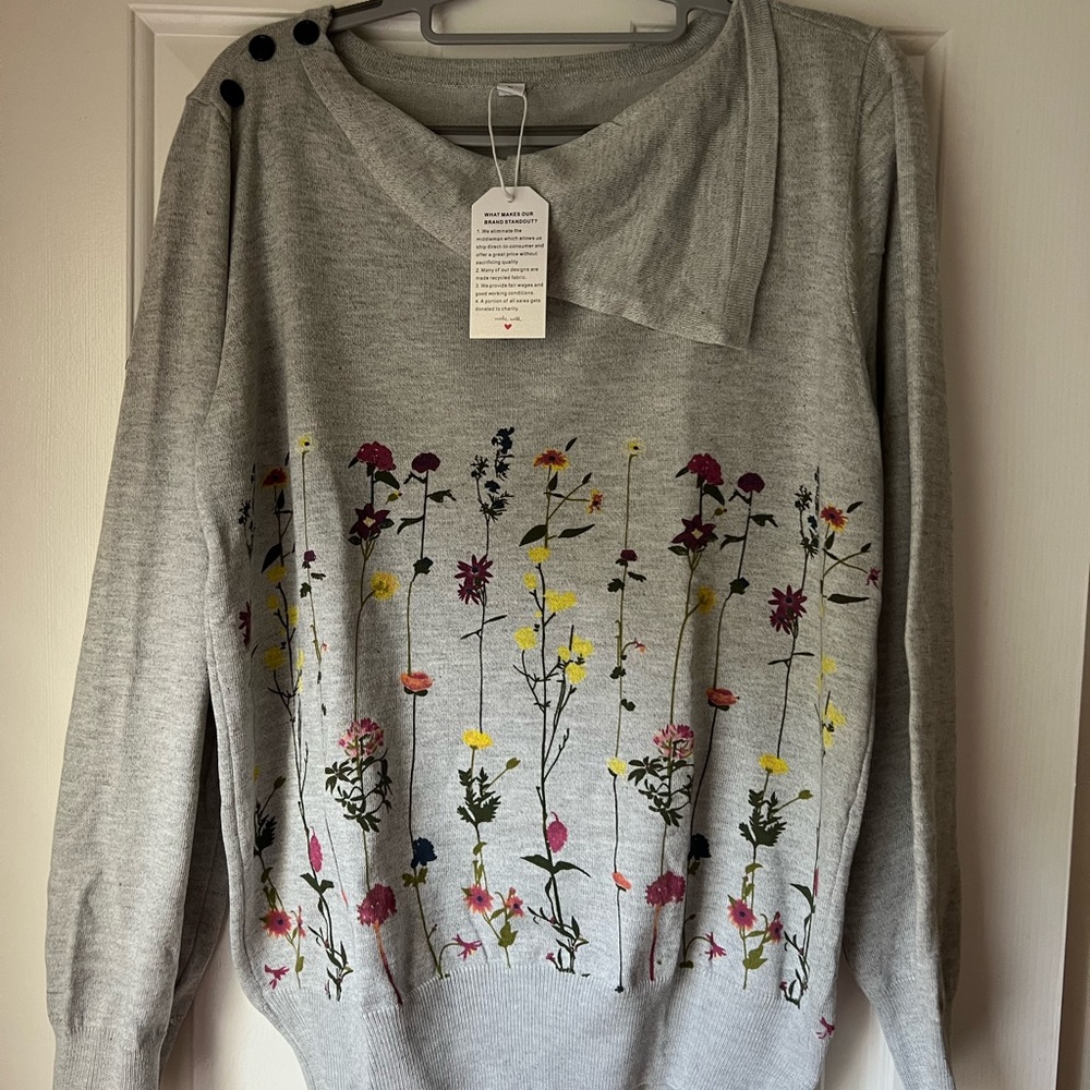 Lightweight gray floral sweater,size large, runs small, never worn,